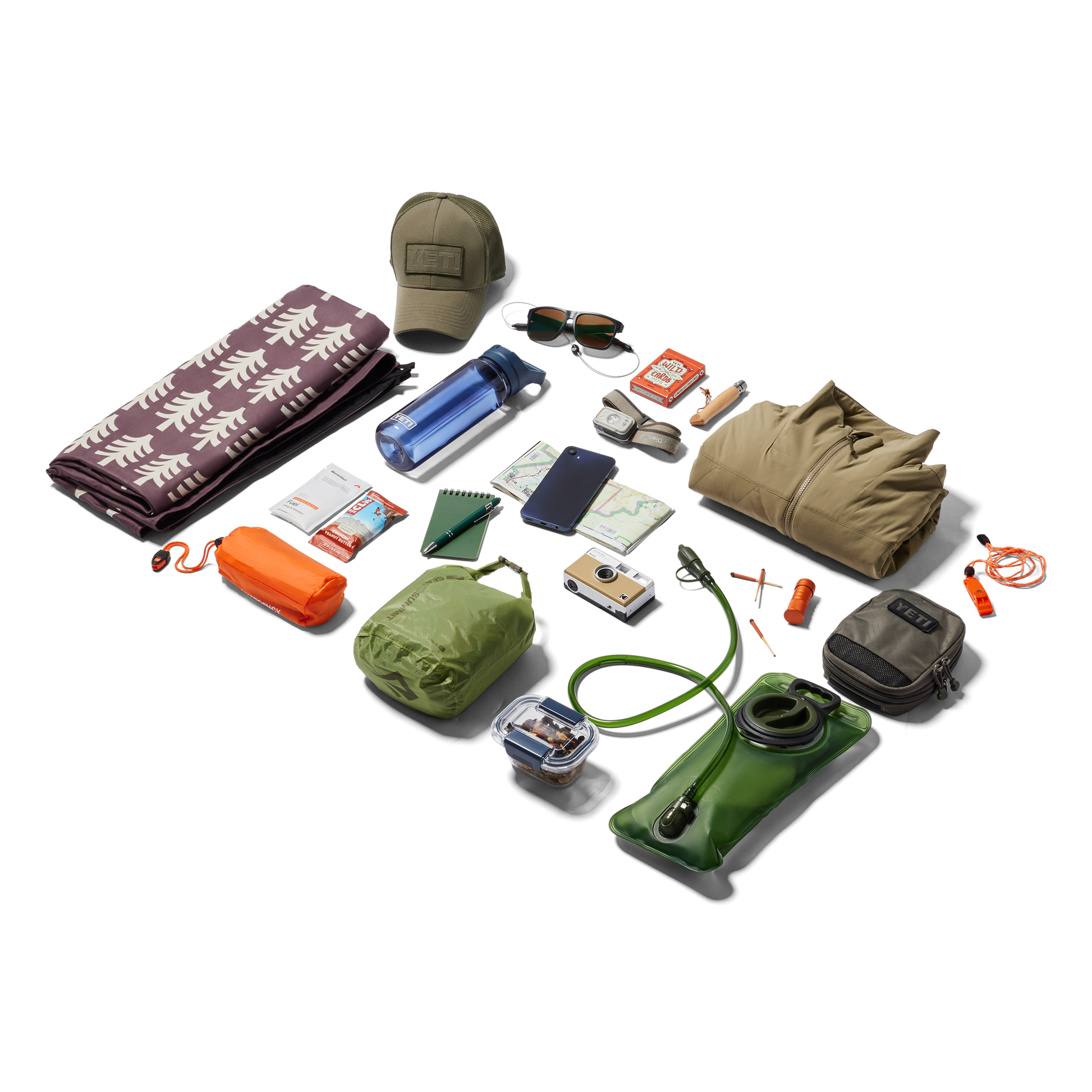 Collection of outdoor gear including a hat, sunglasses, camera, and various bags on a white background